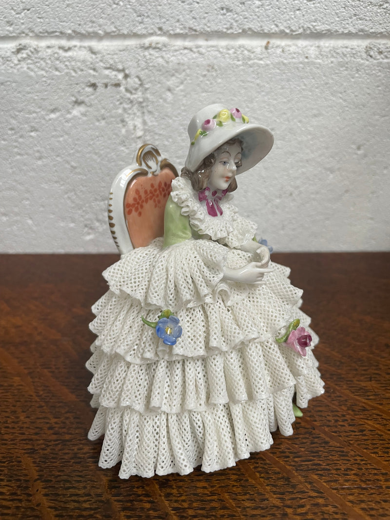 Dresden lace figurine stamped underneath and made in Germany. In good vintage condition with some slight damage to lace.