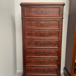 Early 19th Century Louis Phillipe style flame mahogany secretaire drawers. Presents as a seven drawer chest however three drawers are a drop down panel to a beautifully fitted secretaire/desk area. Sourced directly from France and in good original condition especially for its age. 