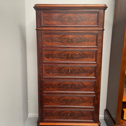 Early 19th Century Louis Phillipe style flame mahogany secretaire drawers. Presents as a seven drawer chest however three drawers are a drop down panel to a beautifully fitted secretaire/desk area. Sourced directly from France and in good original condition especially for its age. 