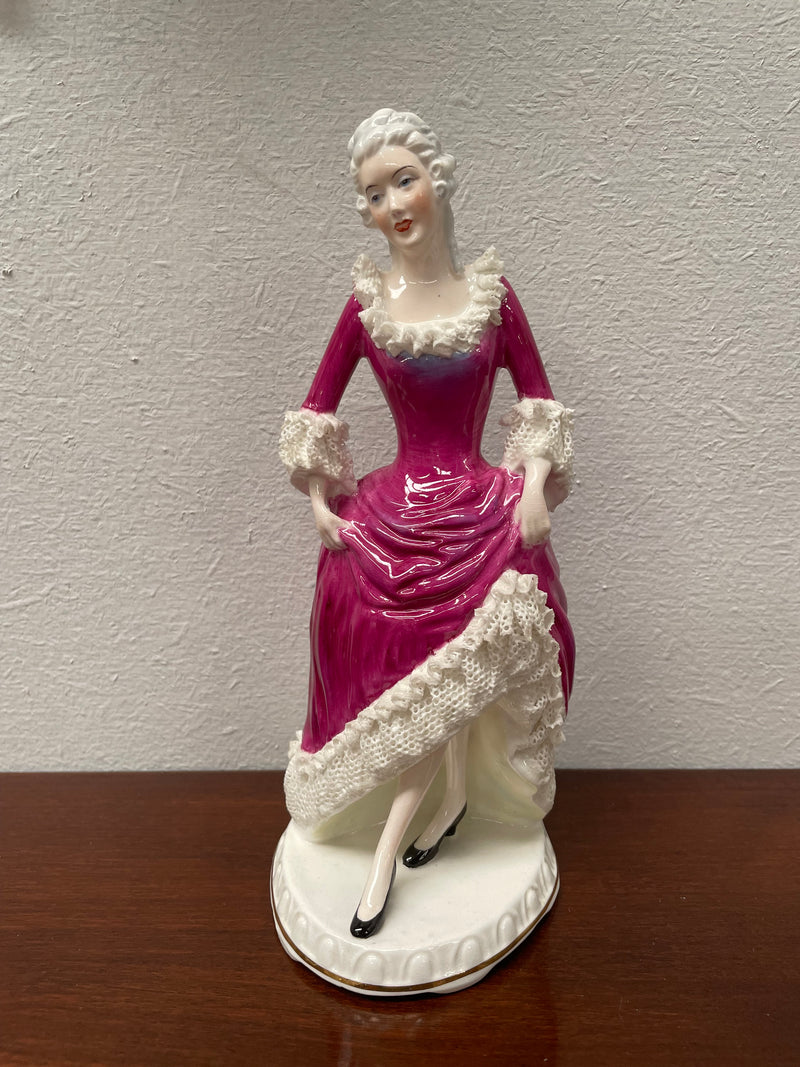 Beautiful English Staffordshire bone china lady figurine with lace. It is in good vintage condition. Please view photos as they help form part of the description.