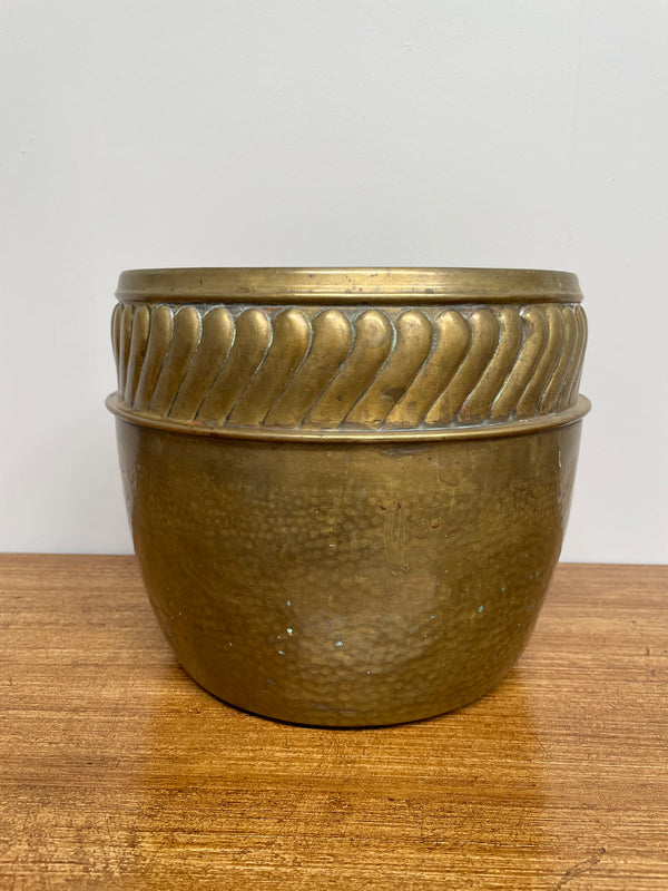 English brass decorative planter pot marked made in England on the base. In good vintage condition.