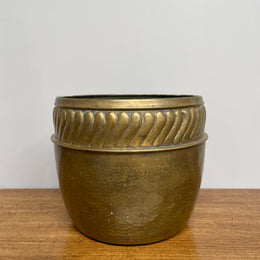 English brass decorative planter pot marked made in England on the base. In good vintage condition.