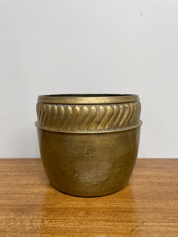 English brass decorative planter pot marked made in England on the base. In good vintage condition.