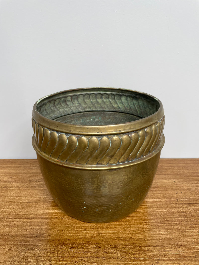 English brass decorative planter pot marked made in England on the base. In good vintage condition.