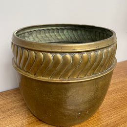 English brass decorative planter pot marked made in England on the base. In good vintage condition.