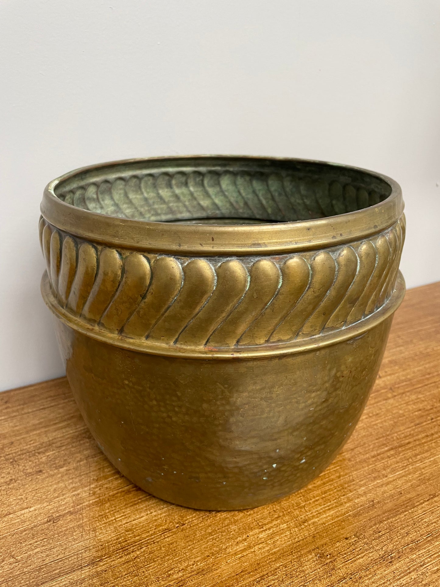 English brass decorative planter pot marked made in England on the base. In good vintage condition.