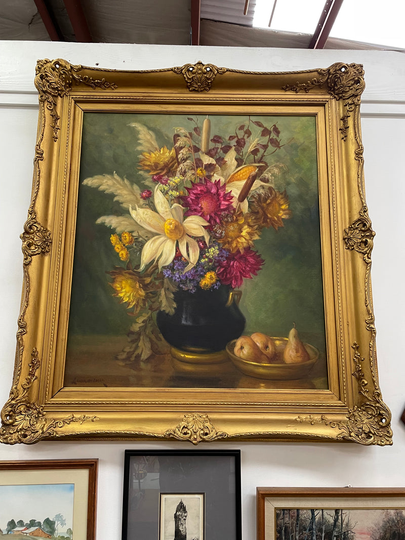 Gorgeous vintage floral oil painting in beautiful colours and a ornate gold frame. Signed by the artist and in good original detailed condition. It has been sourced from France. 