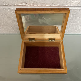 Beautiful Vintage inlaid wooden trinket box with a velvet base and mirror inside. It is in good original condition.