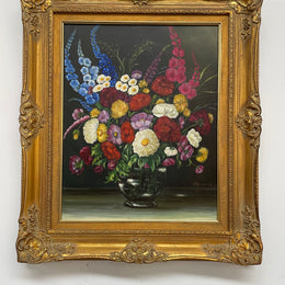 Very pretty oil on canvas painting of flowers in a vase in the most beautiful colours. Signed by the artist and framed in a ornate gilt frame. Ready to hang. Sourced directly from France and in good original condition. 