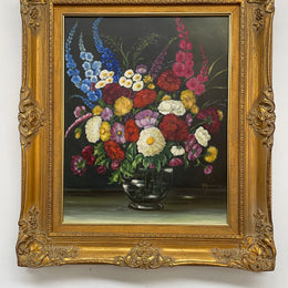 Very pretty oil on canvas painting of flowers in a vase in the most beautiful colours. Signed by the artist and framed in a ornate gilt frame. Ready to hang. Sourced directly from France and in good original condition. 