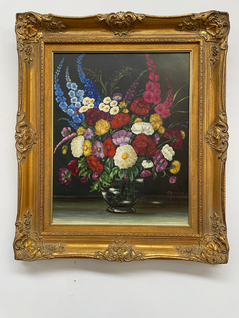 Very pretty oil on canvas painting of flowers in a vase in the most beautiful colours. Signed by the artist and framed in a ornate gilt frame. Ready to hang. Sourced directly from France and in good original condition. 