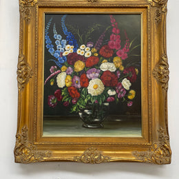 Very pretty oil on canvas painting of flowers in a vase in the most beautiful colours. Signed by the artist and framed in a ornate gilt frame. Ready to hang. Sourced directly from France and in good original condition. 