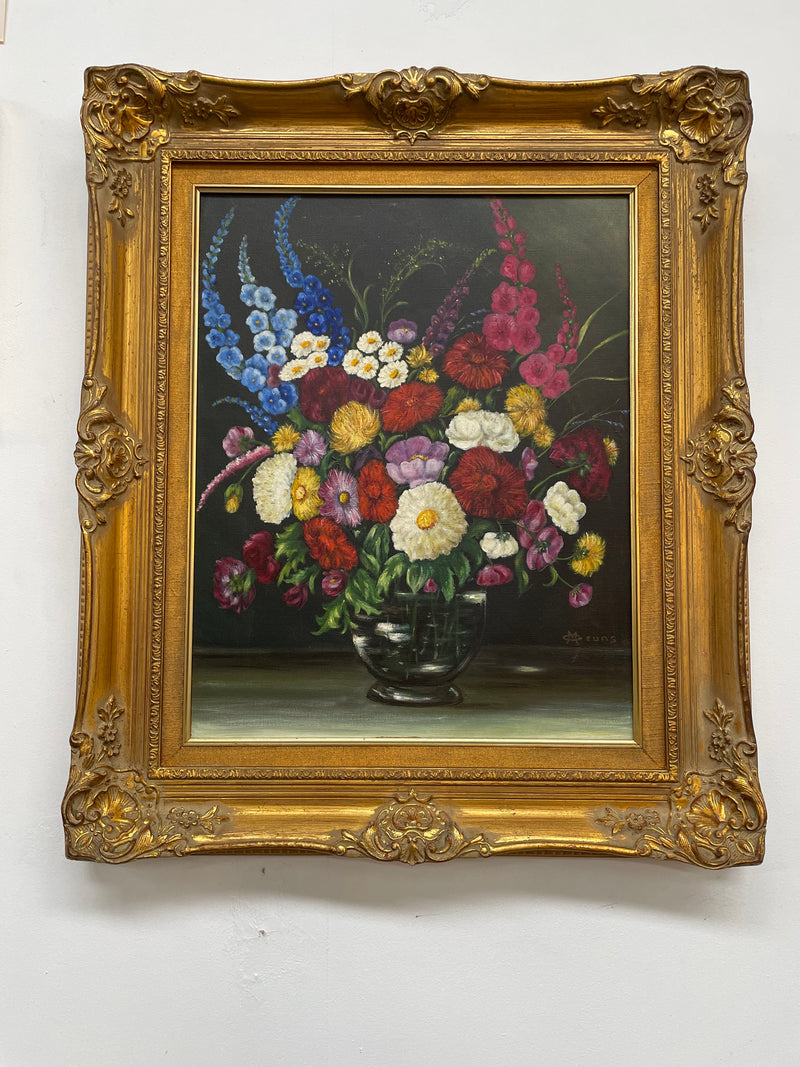 Very pretty oil on canvas painting of flowers in a vase in the most beautiful colours. Signed by the artist and framed in a ornate gilt frame. Ready to hang. Sourced directly from France and in good original condition. 