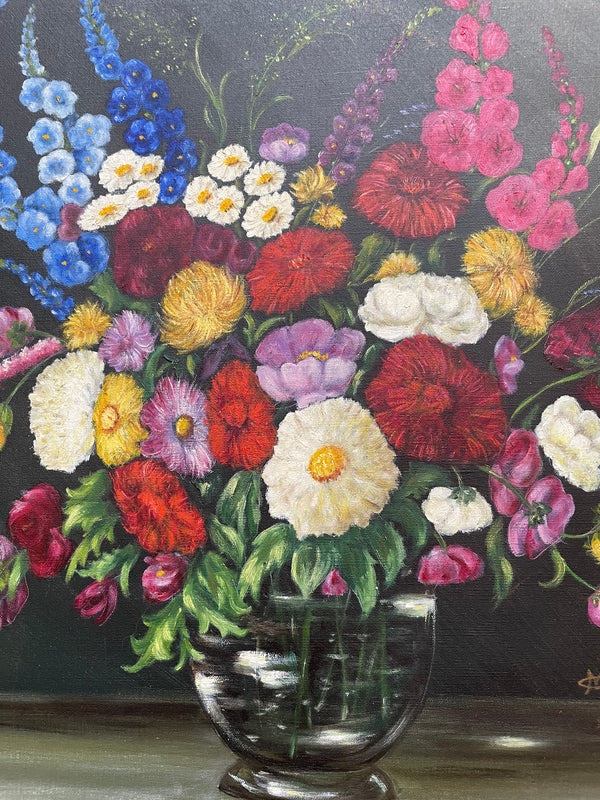 Very pretty oil on canvas painting of flowers in a vase in the most beautiful colours. Signed by the artist and framed in a ornate gilt frame. Ready to hang. Sourced directly from France and in good original condition. 