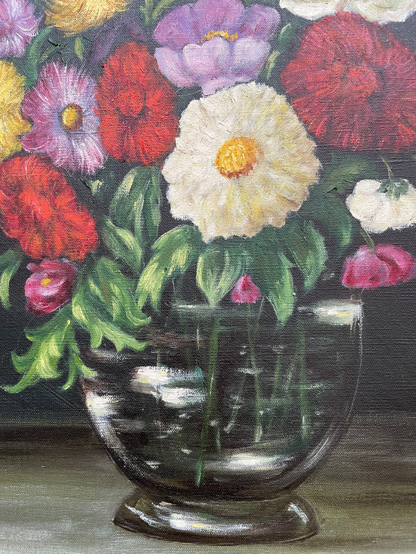 Very pretty oil on canvas painting of flowers in a vase in the most beautiful colours. Signed by the artist and framed in a ornate gilt frame. Ready to hang. Sourced directly from France and in good original condition. 