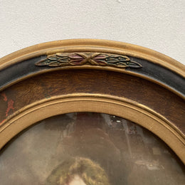 Lovely Art Deco photo frame with beautiful details on the rim and concave glass. Pretty photograph of a young girl in good original condition.