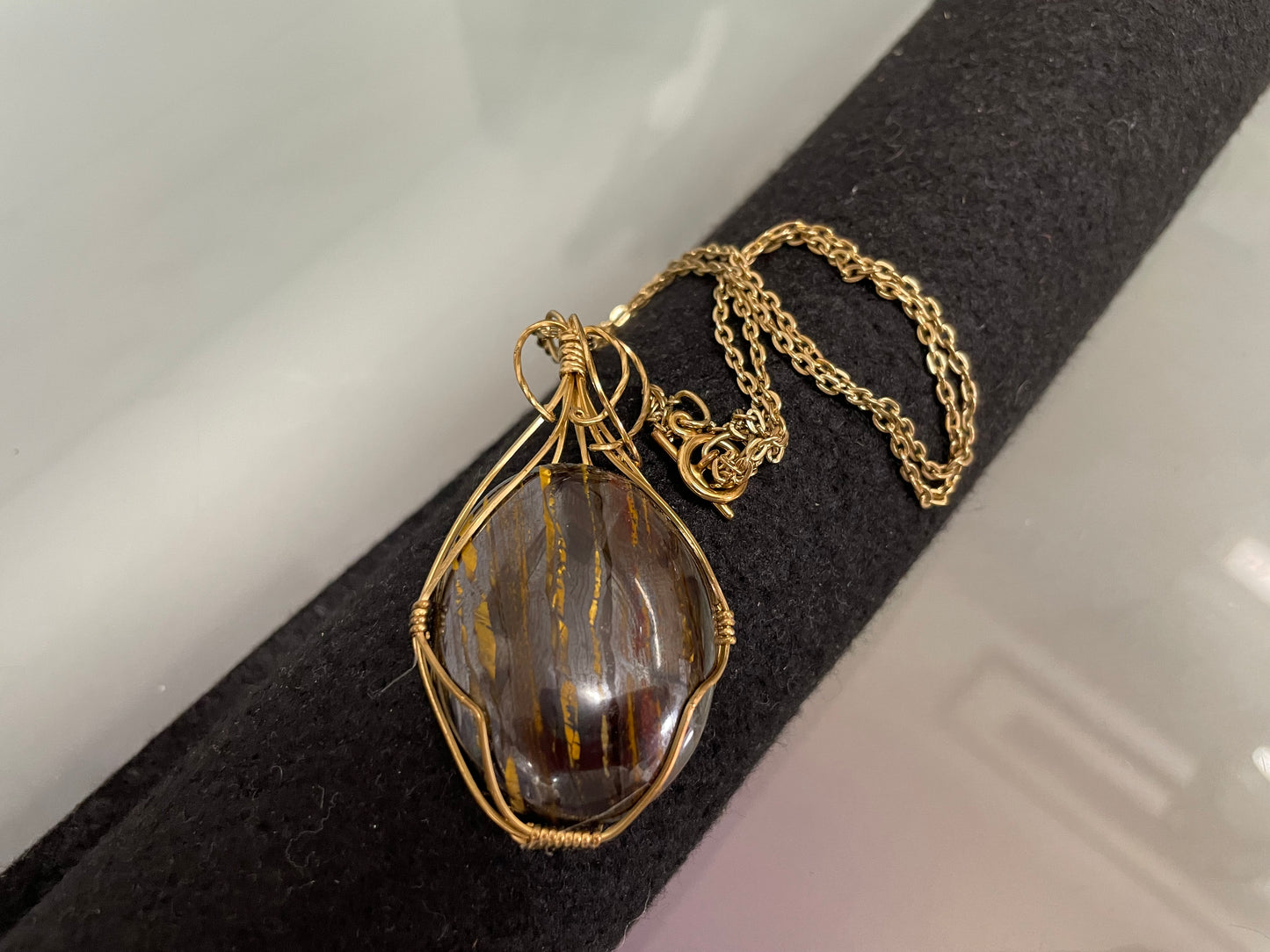 An Attractive Chocolate Calcite Pendant In a Gold Plated Setting