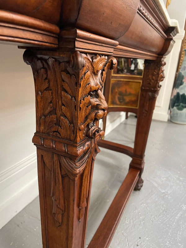 Fabulous French Henry II marble top console table with carved details. It is in good original condition. Please see the photos as they form part of the description.