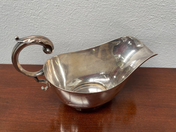 Marked hand soldered vintage gravy boat made in England. It has a lovely handle and is in good original condition. Please see photos as they form part of the description.