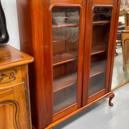 Practical late Victorian Cedar two door bookcase on cabriole feet and adjustable shelves. In good condition. Please see photos as they form part of the description. Circa: 1890's