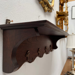 Charming French oak four Cherub shaped hook coat rack with shelf. Sourced from France and is in good original condition.