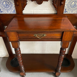Lovely Edwardian single drawer shield mirror mahogany hall stand. It has 6 hooks for hanging and two pretty decorative blue and white tiles. In good original condition