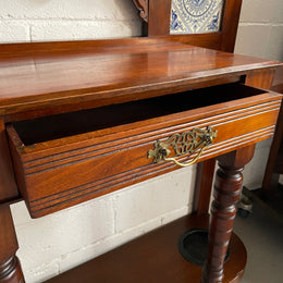 Lovely Edwardian single drawer shield mirror mahogany hall stand. It has 6 hooks for hanging and two pretty decorative blue and white tiles. In good original condition