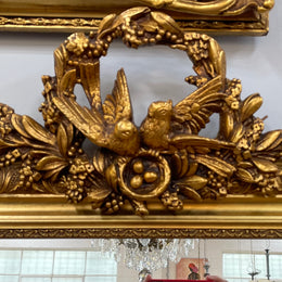 Compact Late 19th Century French Gilt Framed Wall Mirror Featuring Carved Birds