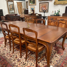 Lovely set of six French rush seat dining chairs. They feature decorative carved detailing particularly to the top of the chair. They are in good original detailed condition and have been sourced from France. 