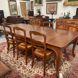 Lovely set of six French rush seat dining chairs. They feature decorative carved detailing particularly to the top of the chair. They are in good original detailed condition and have been sourced from France. 