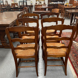 Lovely set of six French rush seat dining chairs. They feature decorative carved detailing particularly to the top of the chair. They are in good original detailed condition and have been sourced from France. 