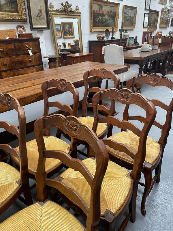 Set of six French Oak Louis XV style rush seat dining chairs . Nicely carved details and they have been sourced directly from France. They are in good original detailed condition.