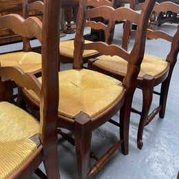 Set of six French Oak Louis XV style rush seat dining chairs . Nicely carved details and they have been sourced directly from France. They are in good original detailed condition.