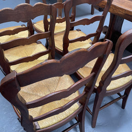 Set of six French Oak Louis XV style rush seat dining chairs . Nicely carved details and they have been sourced directly from France. They are in good original detailed condition.