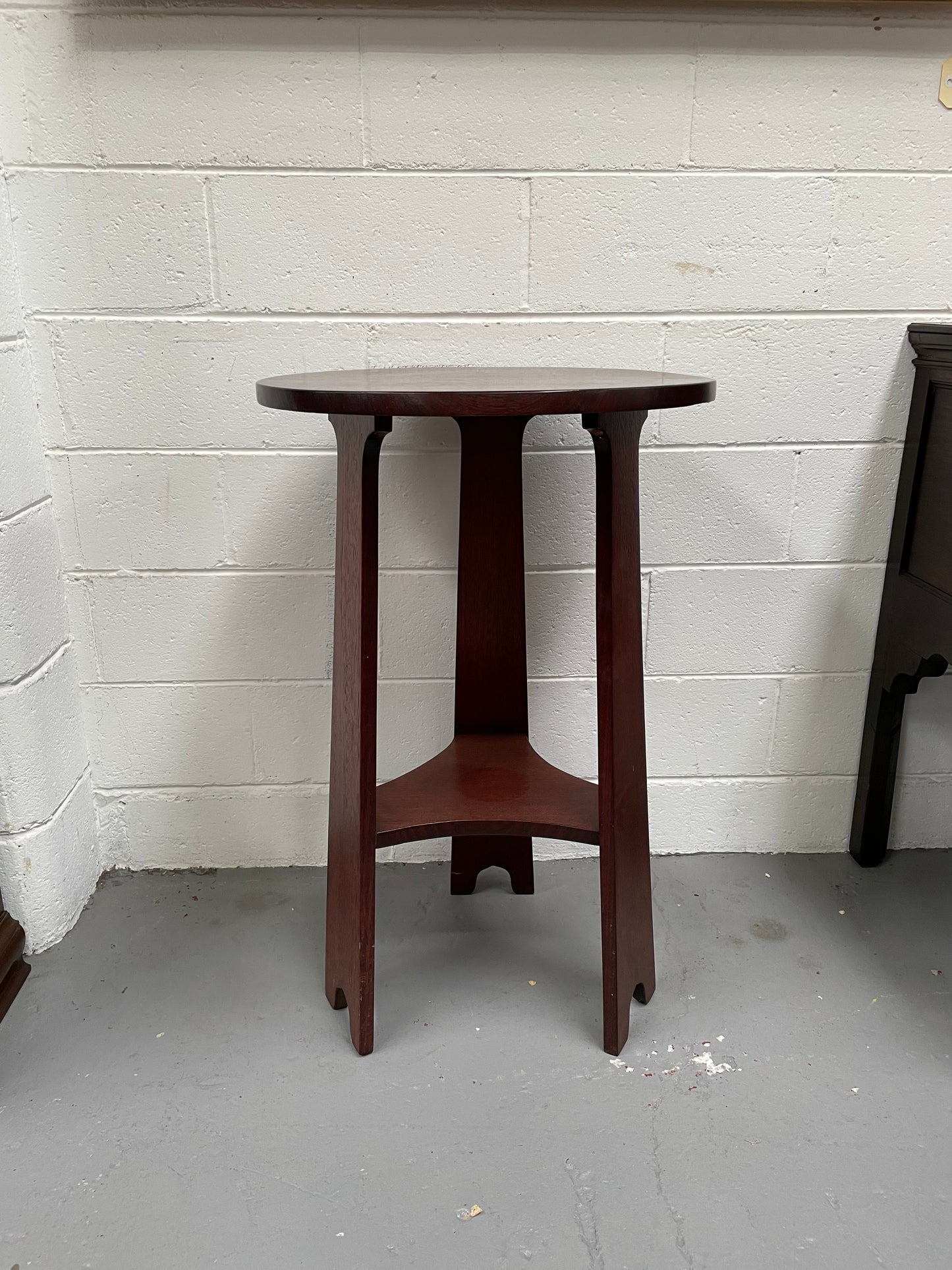 Practical round Arts and Crafts side table stained in a mahogany colour. Sourced locally and in good original condition. Please see all photos as they form part of the description and condition.