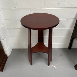 Practical round Arts and Crafts side table stained in a mahogany colour. Sourced locally and in good original condition. Please see all photos as they form part of the description and condition.