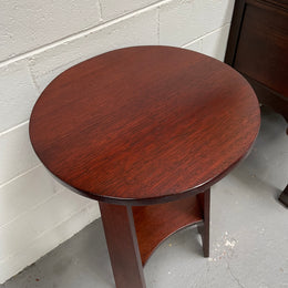 Practical round Arts and Crafts side table stained in a mahogany colour. Sourced locally and in good original condition. Please see all photos as they form part of the description and condition.