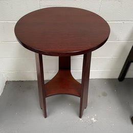 Practical round Arts and Crafts side table stained in a mahogany colour. Sourced locally and in good original condition. Please see all photos as they form part of the description and condition.