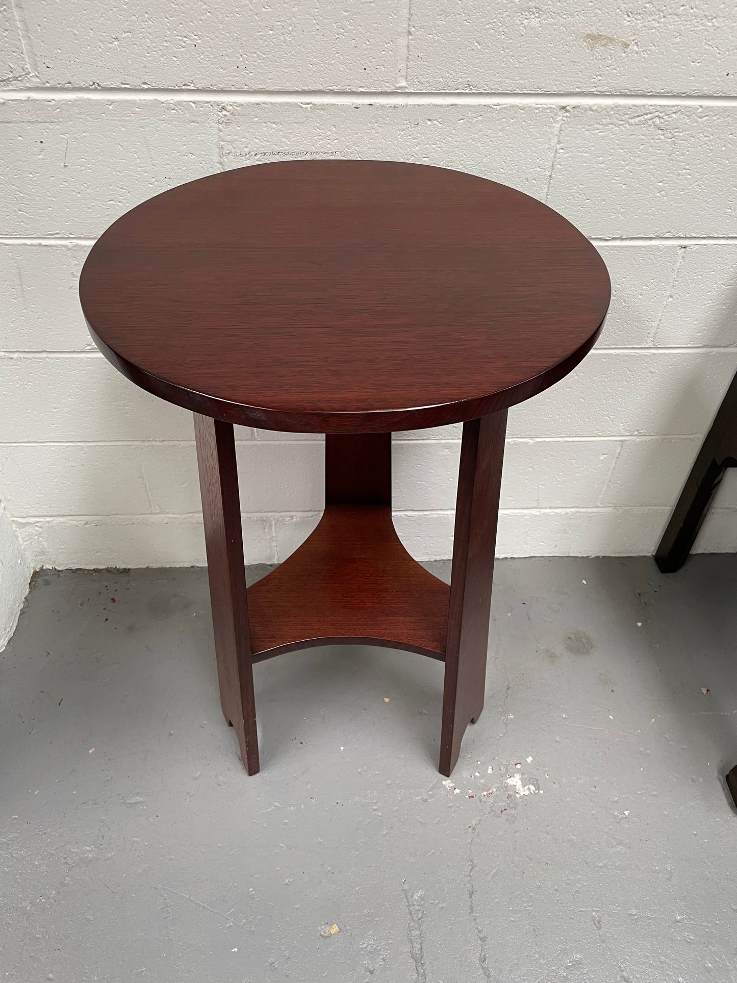 Practical round Arts and Crafts side table stained in a mahogany colour. Sourced locally and in good original condition. Please see all photos as they form part of the description and condition.