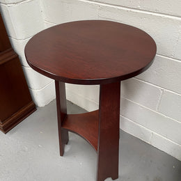 Practical round Arts and Crafts side table stained in a mahogany colour. Sourced locally and in good original condition. Please see all photos as they form part of the description and condition.