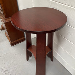 Practical round Arts and Crafts side table stained in a mahogany colour. Sourced locally and in good original condition. Please see all photos as they form part of the description and condition.