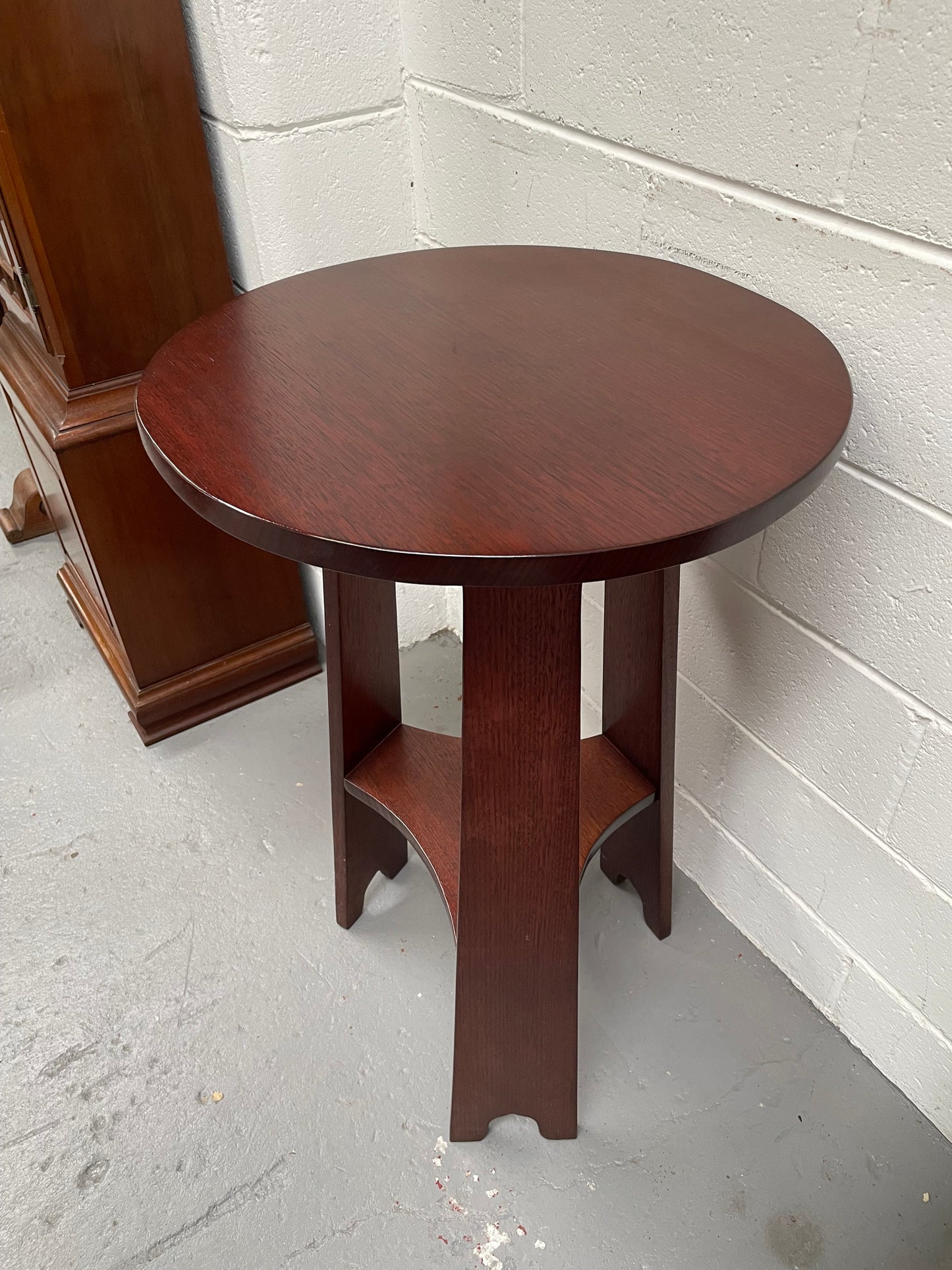 Practical round Arts and Crafts side table stained in a mahogany colour. Sourced locally and in good original condition. Please see all photos as they form part of the description and condition.