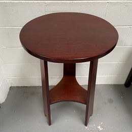 Practical round Arts and Crafts side table stained in a mahogany colour. Sourced locally and in good original condition. Please see all photos as they form part of the description and condition.