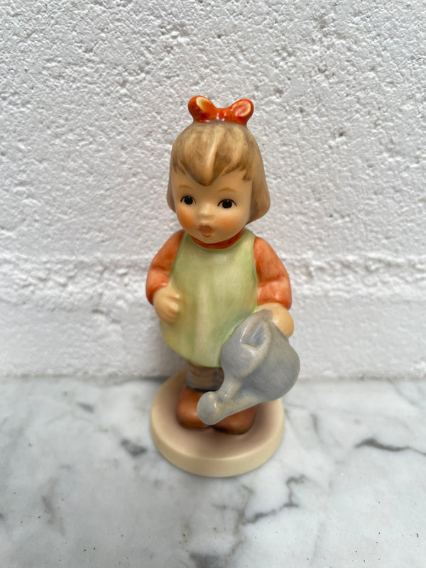Beautiful Goebel Hummel figurine "Natures Gift" dated 1996, of a girl with her watering can. In good original condition, please see photos as they form part of the description.