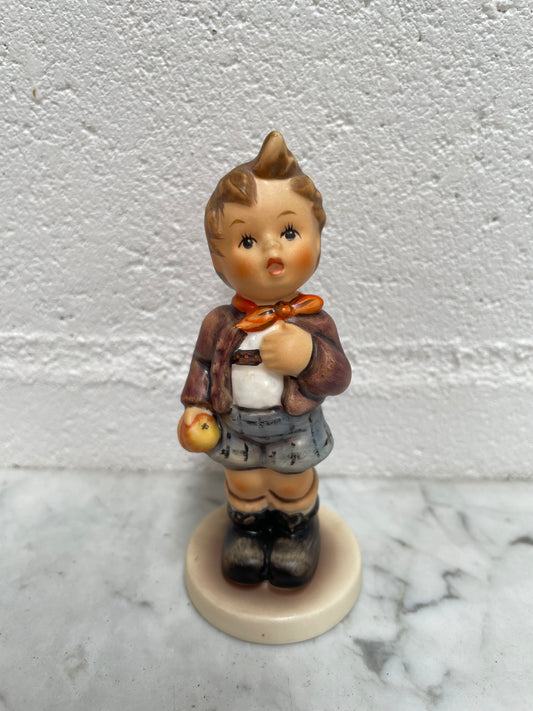Sweet Vintage Hummel figurine "Cheeky Fellow" 1992 of a boy with his apple. It is in good original condition. Please see photos as they form part of the description.