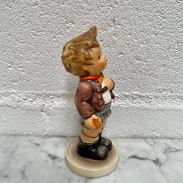 Sweet Vintage Hummel figurine "Cheeky Fellow" 1992 of a boy with his apple. It is in good original condition. Please see photos as they form part of the description.