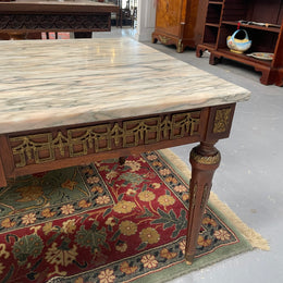 Impressive Louis XVI style walnut coffee table. Stunning marble top, gilt mounts and fluted legs. Circa: 1950's. In good original condition.