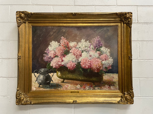 Vibrant floral original oil painting on canvas by M Hulin in decorative gilt frame. It has been sourced in France and is in good original condition. 