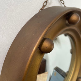 An elegant compact round convex wall mirror with lovely details that has been sourced directly from France. It is in good original condition. Please see photos as they form part of the description and condition.