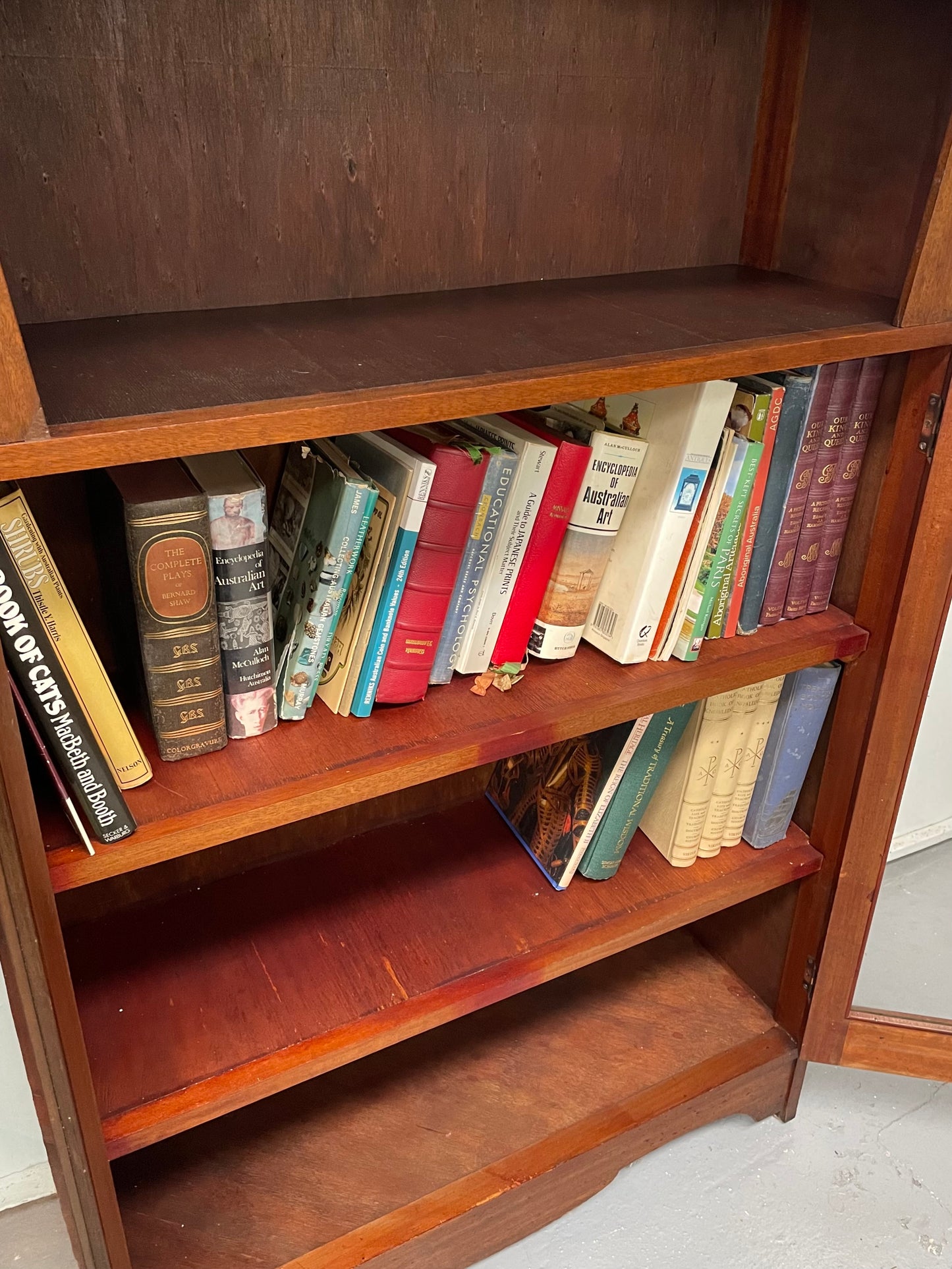 Practical Arts and Crafts <span data-mce-fragment="1"> bookcase featuring two glass doors and three fixed shelves. Perfect for organizing your books or showcasing your favorite pieces, this bookcase also includes a top shelf for additional display space. I</span>t has been sourced locally and is in good original condition.